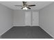 Bright bedroom with ceiling fan and two closets at 625 Armitage Way, Stockbridge, GA 30281