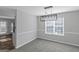 Dining room with kitchen views and a modern light fixture at 625 Armitage Way, Stockbridge, GA 30281