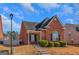 Brick ranch house with landscaping and a walkway at 625 Armitage Way, Stockbridge, GA 30281