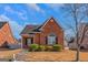 Brick ranch house with landscaping and a walkway at 625 Armitage Way, Stockbridge, GA 30281