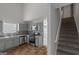 Renovated kitchen with light gray cabinets and stainless steel appliances at 625 Armitage Way, Stockbridge, GA 30281