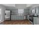 Renovated kitchen with light gray cabinets and stainless steel appliances at 625 Armitage Way, Stockbridge, GA 30281