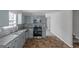Renovated kitchen with light gray cabinets and stainless steel appliances at 625 Armitage Way, Stockbridge, GA 30281