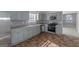 Renovated kitchen with light gray cabinets and stainless steel appliances at 625 Armitage Way, Stockbridge, GA 30281