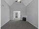 Spacious living room with gray carpet and a corner fireplace at 625 Armitage Way, Stockbridge, GA 30281