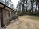 Private backyard with grassy area and trees at 3780 Cedar Hurst Way, South Fulton, GA 30349