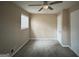 Spacious bedroom with ceiling fan and window at 3780 Cedar Hurst Way, South Fulton, GA 30349