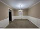 Bright dining room with chandelier and neutral color palette at 3780 Cedar Hurst Way, South Fulton, GA 30349