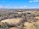 Aerial view showcasing house and expansive land at 295 W 5 Hwy, Roopville, GA 30170