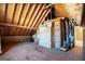Unfinished attic space with wood flooring and storage at 295 W 5 Hwy, Roopville, GA 30170