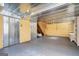 Unfinished basement with metal ceiling and shelving at 295 W 5 Hwy, Roopville, GA 30170
