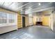 Unfinished basement with metal ceiling and built-in shelving at 295 W 5 Hwy, Roopville, GA 30170