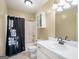 Bathroom with shower/tub combo, vanity, and linen storage at 295 W 5 Hwy, Roopville, GA 30170