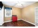 Spacious bedroom with wood flooring and a ceiling fan at 295 W 5 Hwy, Roopville, GA 30170