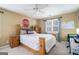 Bright bedroom with a wooden bed frame and window at 295 W 5 Hwy, Roopville, GA 30170
