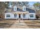White two-story house with front porch and landscaping at 295 W 5 Hwy, Roopville, GA 30170
