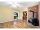 Gathering room with wood burning stove and view of kitchen at 295 W 5 Hwy, Roopville, GA 30170