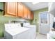 Convenient laundry room with washer, dryer, and cabinets at 295 W 5 Hwy, Roopville, GA 30170