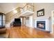 Living room with hardwood floors, fireplace, and high ceilings at 295 W 5 Hwy, Roopville, GA 30170