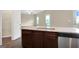 Kitchen island with granite countertop and stainless steel dishwasher at 117 Oliver Dr, Locust Grove, GA 30248