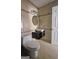 Bathroom with beige tile, modern vanity, and a large mirror at 6665 Cedar Hurst Trl, College Park, GA 30349