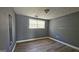 Cozy bedroom with mirrored closet and window at 6665 Cedar Hurst Trl, College Park, GA 30349