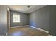 Bright bedroom featuring laminate wood flooring at 6665 Cedar Hurst Trl, College Park, GA 30349