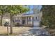 Ranch style home with gray siding, brick accents, and a two-car garage at 6665 Cedar Hurst Trl, College Park, GA 30349