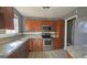 Kitchen with wood cabinets, stainless steel appliances, and granite countertops at 6665 Cedar Hurst Trl, College Park, GA 30349