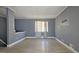 Spacious living room with light gray walls and wood-look flooring at 6665 Cedar Hurst Trl, College Park, GA 30349
