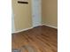 Small bedroom with hardwood floors and a closet at 20 Tara Way, Covington, GA 30016