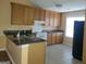 Kitchen with granite countertops and wood cabinets at 20 Tara Way, Covington, GA 30016