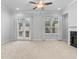 Open living room with French doors and large windows at 1208 Stone Castle Cir # 3, Smyrna, GA 30080