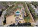 Overhead shot of a community with tennis courts, a pool, a clubhouse, and parking at 112 Centennial Dr, Peachtree City, GA 30269