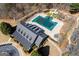 Aerial view of a community clubhouse, pool, playground, and surrounding greenery at 112 Centennial Dr, Peachtree City, GA 30269