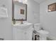 Simple bathroom with white vanity and toilet at 1081 Veltre Sw Cir, Atlanta, GA 30311