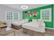 Guest bedroom with two twin beds and green accent wall at 1081 Veltre Sw Cir, Atlanta, GA 30311