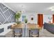 Elegant dining room with a large wooden table and geometric wall decor at 1081 Veltre Sw Cir, Atlanta, GA 30311