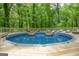 Relaxing above ground pool with wooden deck at 1081 Veltre Sw Cir, Atlanta, GA 30311