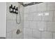 Clean shower with marble-look tile and modern fixtures at 1081 Veltre Sw Cir, Atlanta, GA 30311