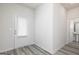 Foyer with white door, gray flooring, and a view of a half-bathroom at 431 Prescott Way, Villa Rica, GA 30180