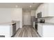 Kitchen with white cabinets, granite countertops, and stainless steel appliances at 431 Prescott Way, Villa Rica, GA 30180