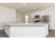 Kitchen island with granite countertops and stainless steel sink at 445 Prescott Way, Villa Rica, GA 30180