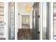 Bright entryway with elegant chandelier and dark front door at 8445 Nolandwood Ln, Villa Rica, GA 30180