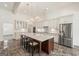 Modern kitchen with a large island, stainless steel appliances, and white cabinetry at 8445 Nolandwood Ln, Villa Rica, GA 30180