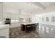 Modern kitchen with a large island, stainless steel appliances, and white cabinetry at 8445 Nolandwood Ln, Villa Rica, GA 30180