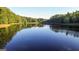 Stunning view of a calm lake reflecting the sky at 8445 Nolandwood Ln, Villa Rica, GA 30180