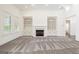 Bright living room featuring a fireplace and built-in shelving units at 8445 Nolandwood Ln, Villa Rica, GA 30180