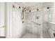 Walk-in shower with marble tile and built-in seat at 8445 Nolandwood Ln, Villa Rica, GA 30180