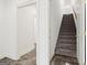 Carpeted staircase leading to upper level at 8445 Nolandwood Ln, Villa Rica, GA 30180